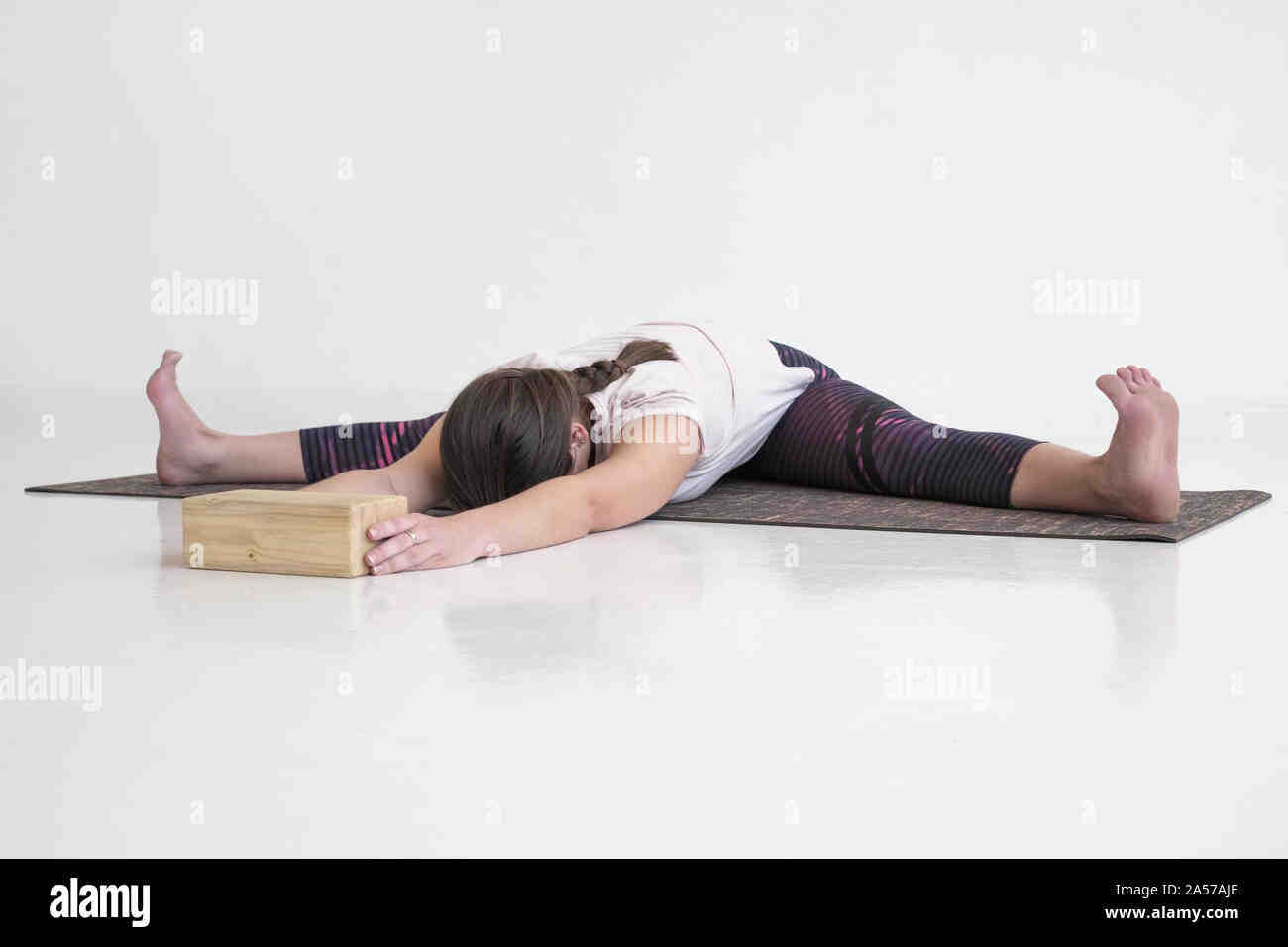 What are the benefits of the wide angle forward bend yoga pose?